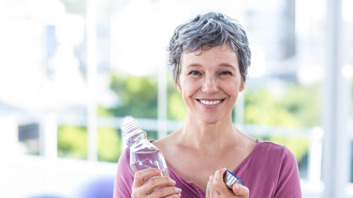 happy older woman with water