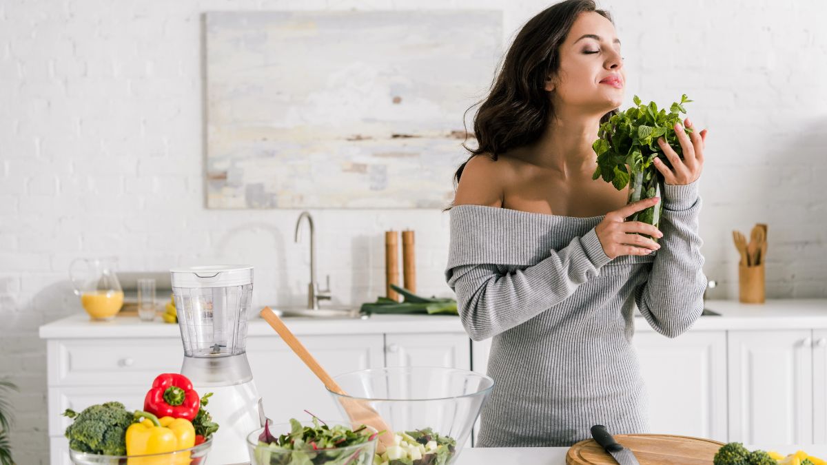 happy woman smelling herbs