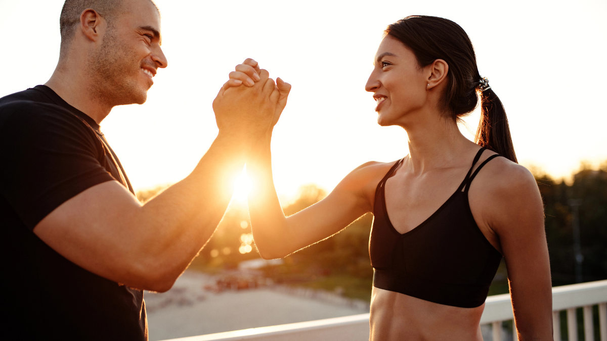 man and woman high five