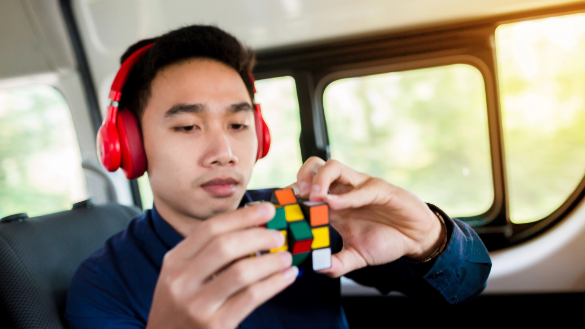 man doing rubiks cube