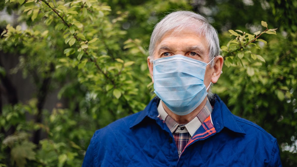 man with mask outside