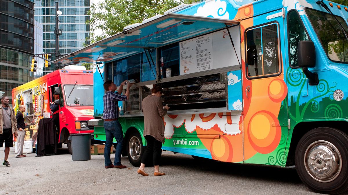 people at food trucks