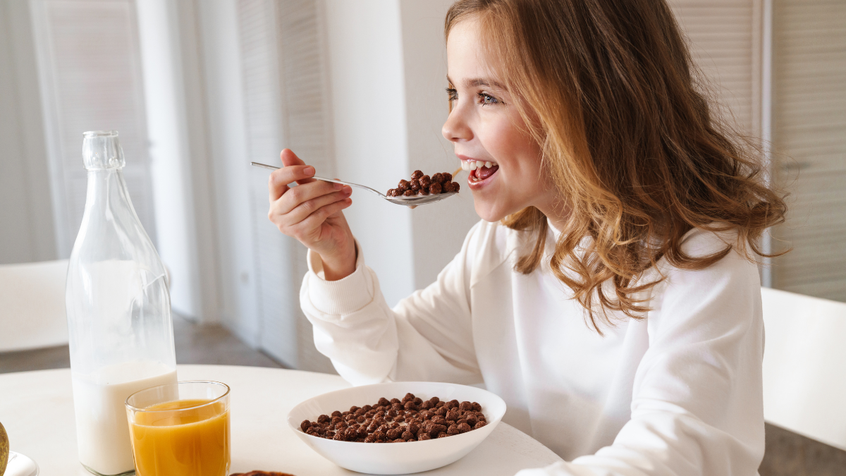 teen eating cereal