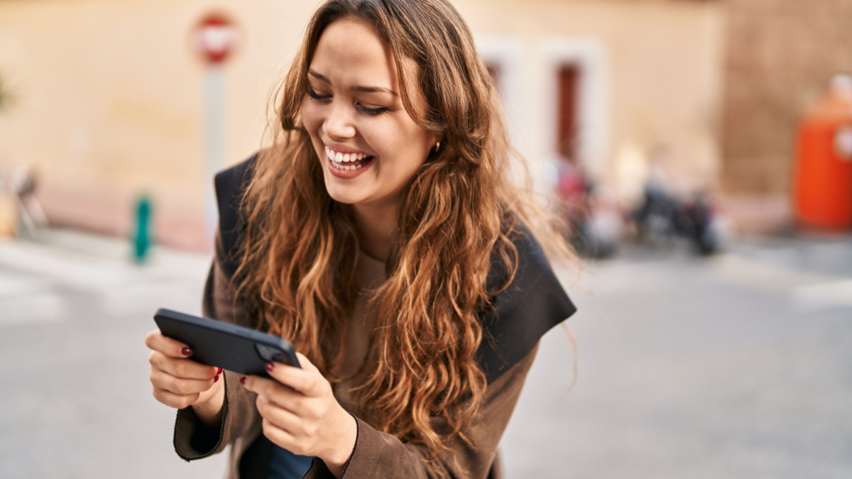 woman laughing at phone