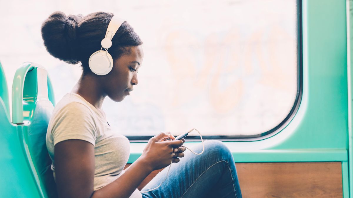 woman listening to headphones