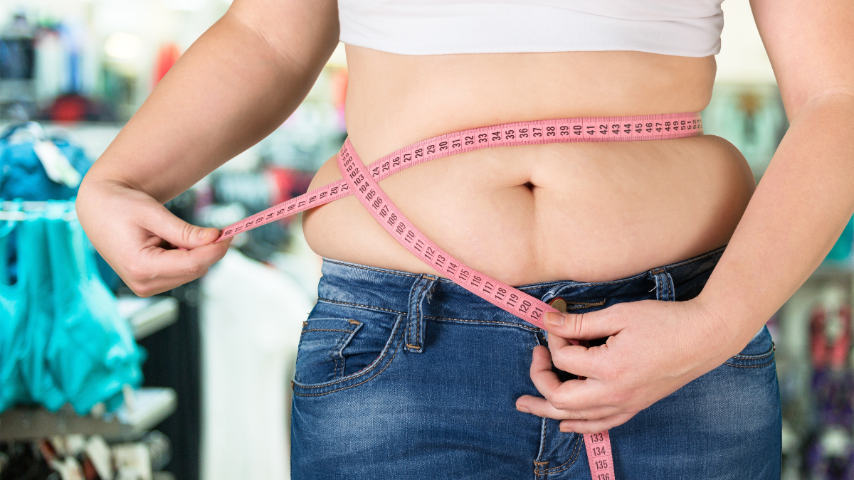 woman measuring stomach