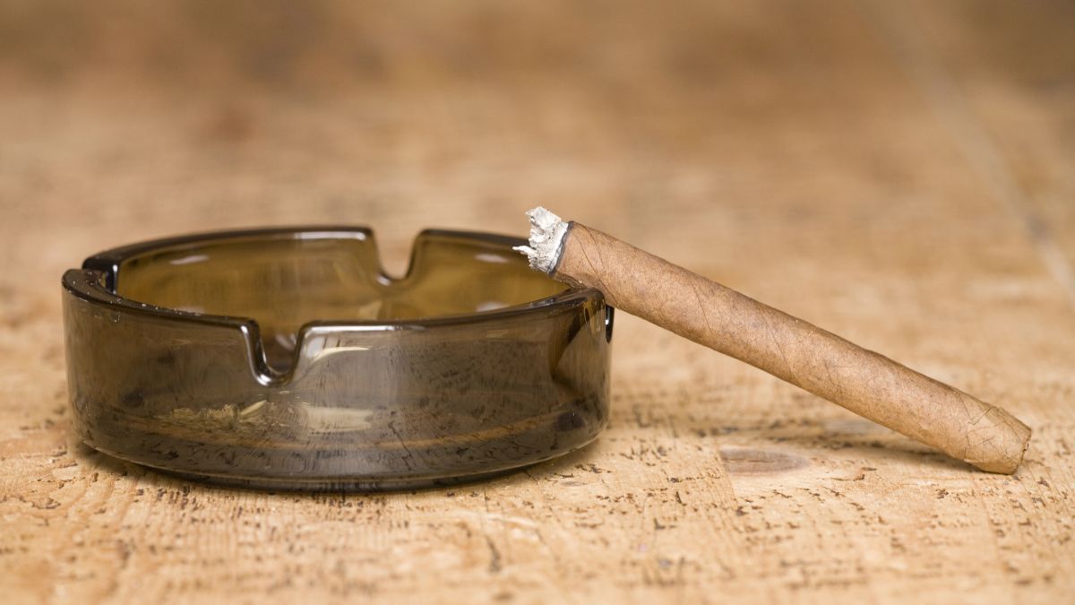 ash tray and cigar