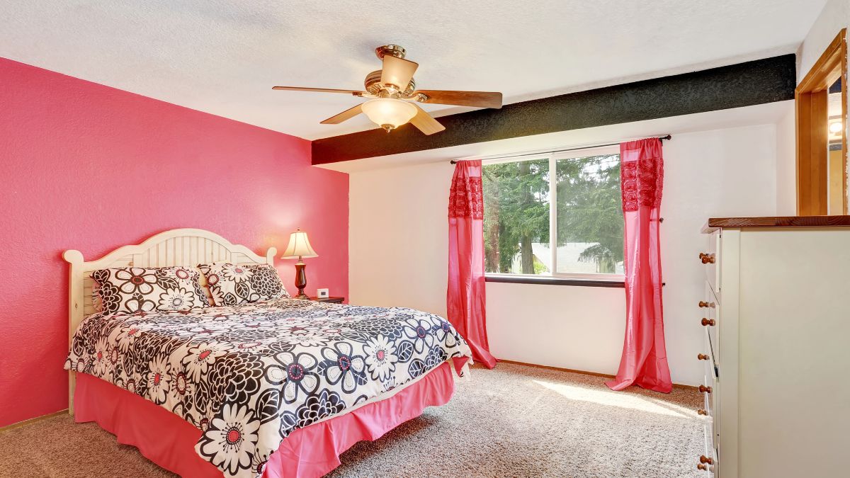 bedroom with pink accent wall