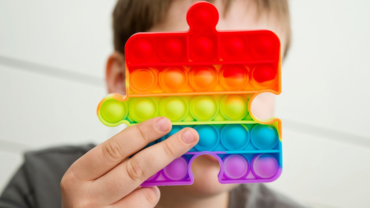 child holding popit toy