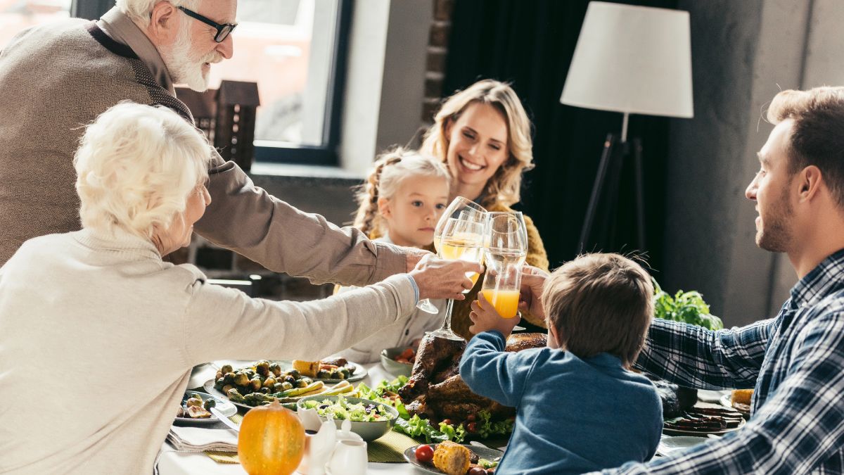 family thanksgiving dinner doing cheers