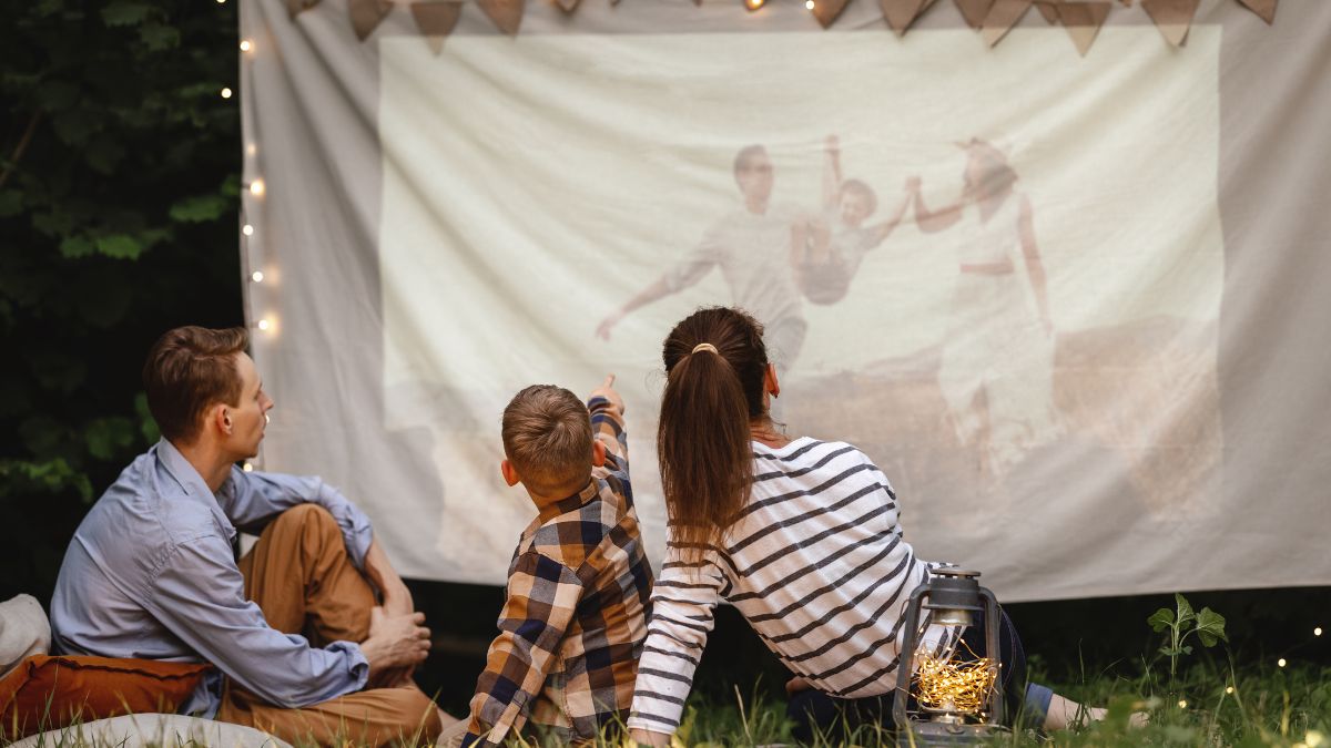 family watching movie outside