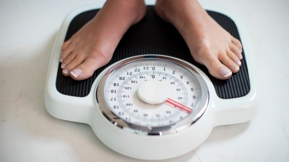 feet on scale checking weight