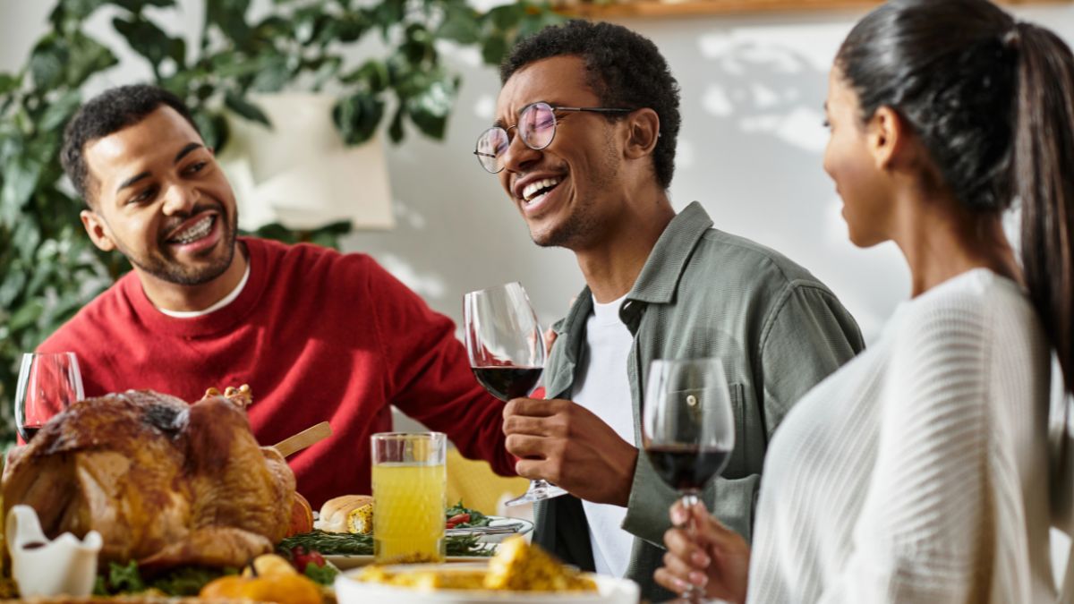 friends with wine enjoying dinner