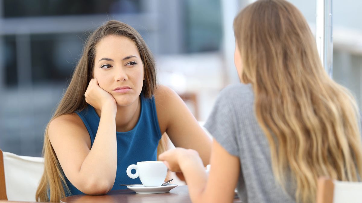 frustrated woman talking at table
