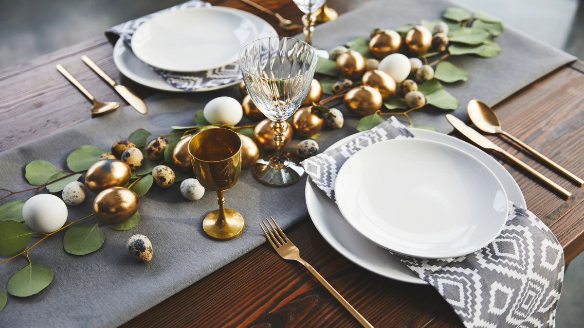 gold silverware and simple plates