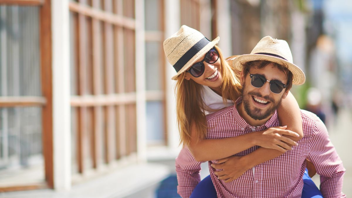 happy couple hugging outside