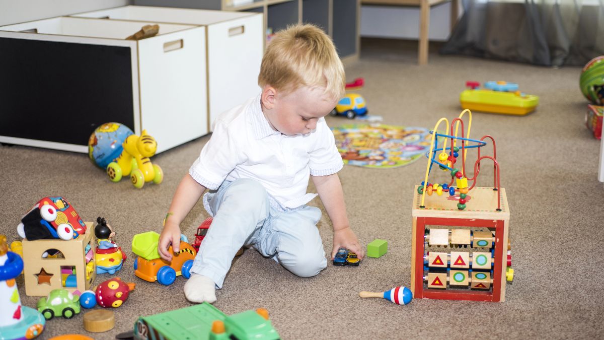 little boy with toys