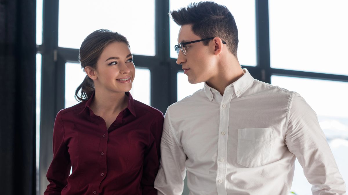 man and woman standing together at work