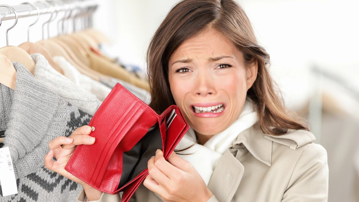 upset woman with empty wallet