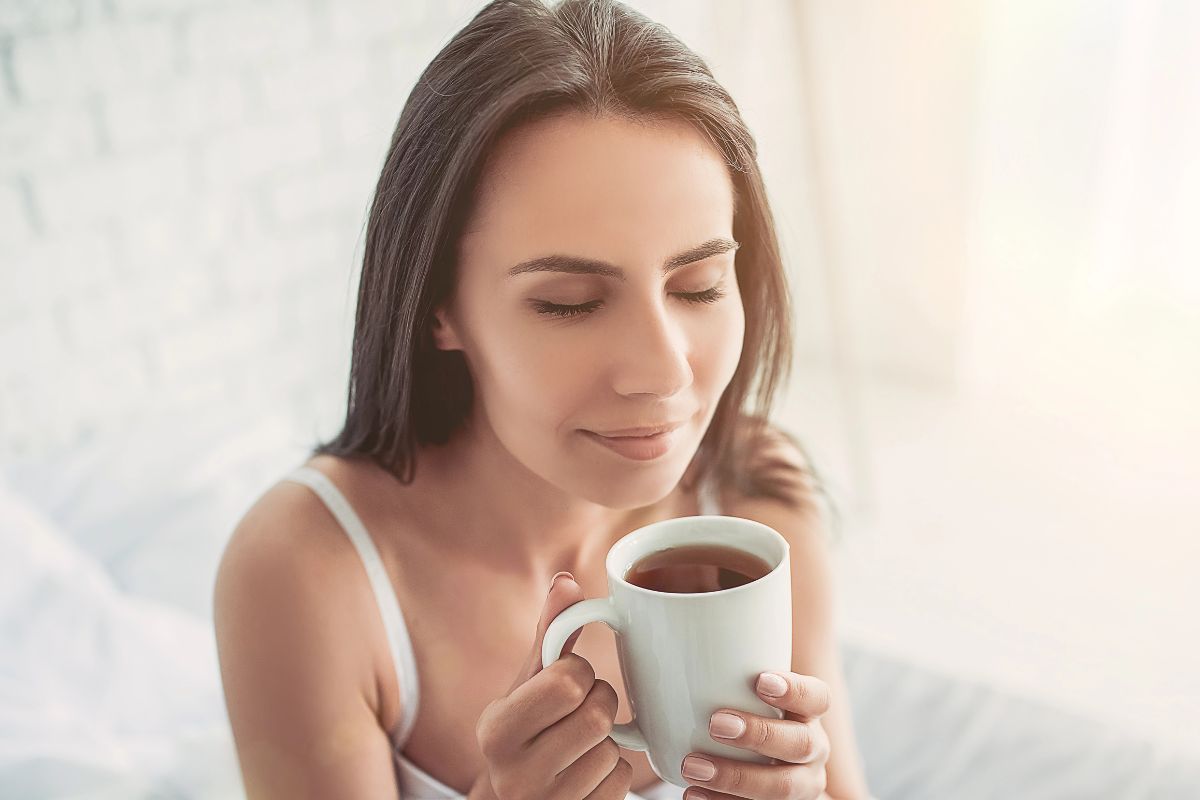 woman having coffee in bed.