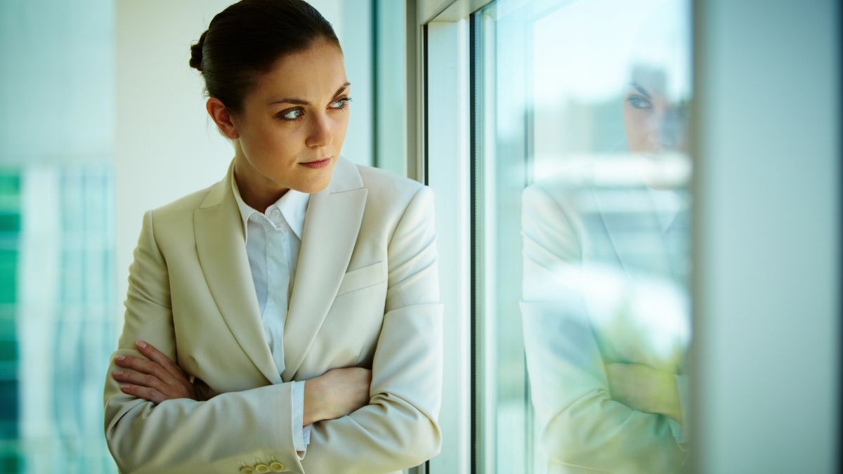 woman looking she by the window