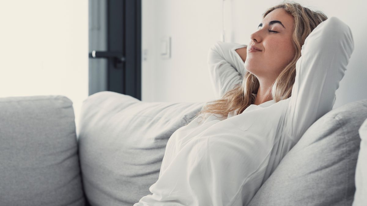 woman resting on couch