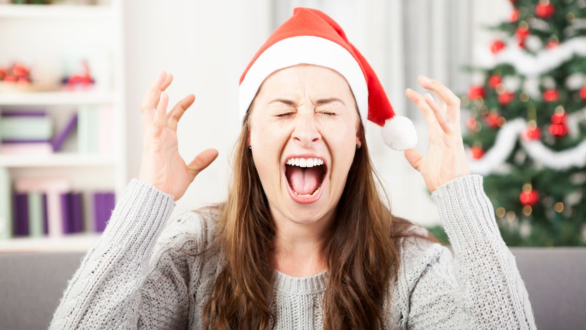 woman stressed with santa hat