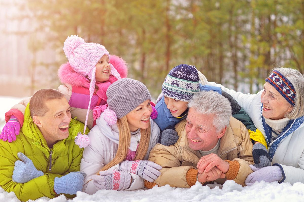 Family in the snow with grandparents