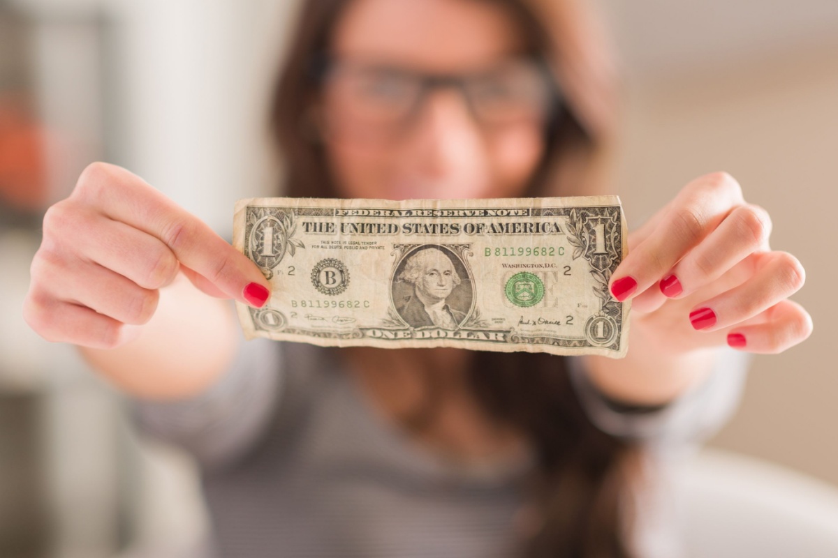 Happy Woman Holding American Dollar