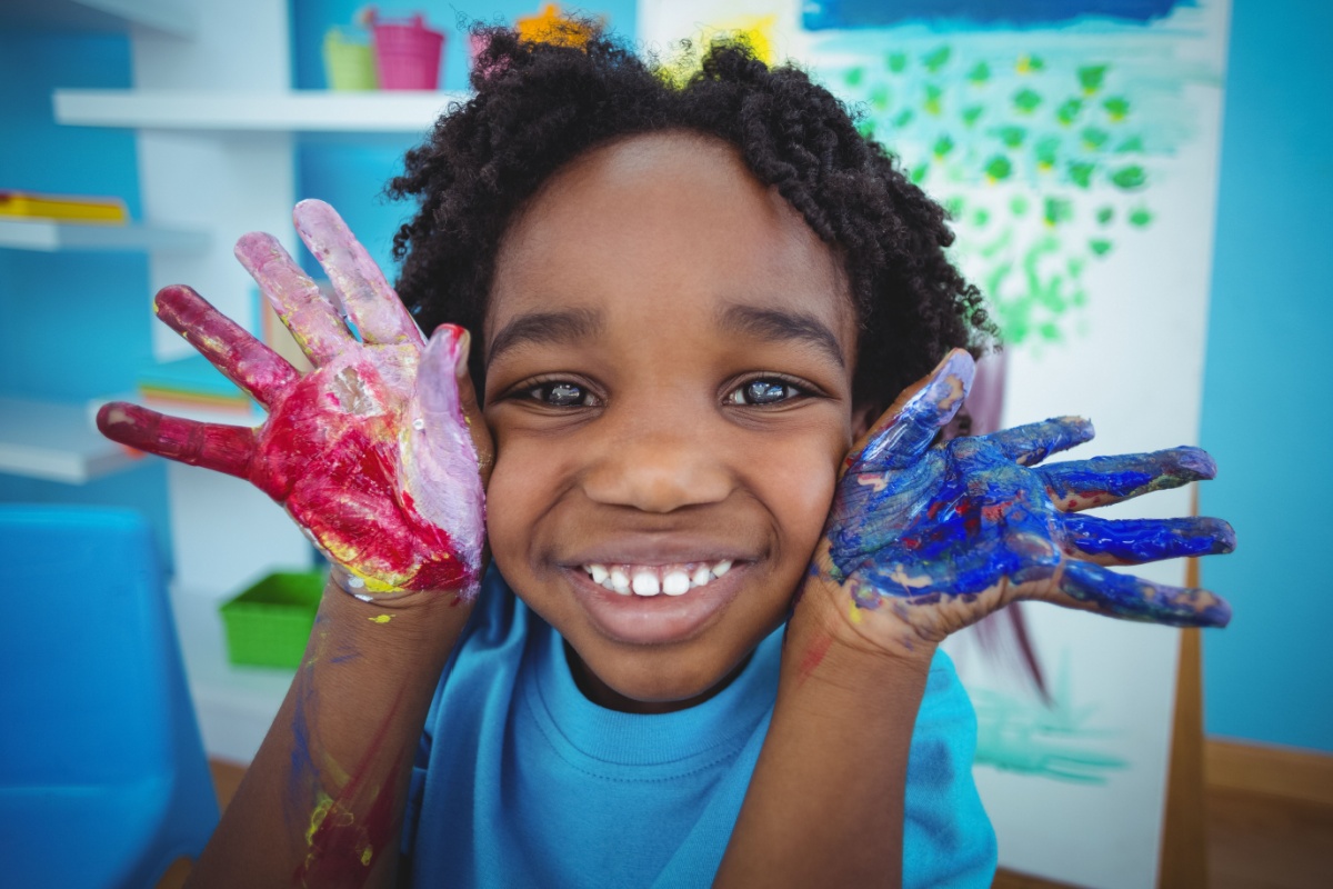 Happy kid enjoying arts and crafts