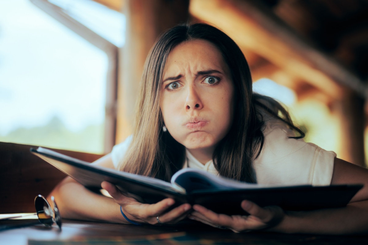 Woman Checking the Prices in a Restaurant