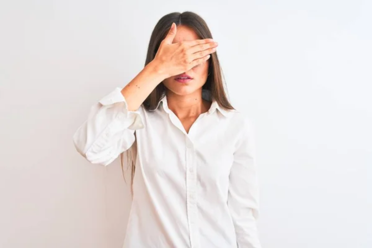 Woman Covering Eyes