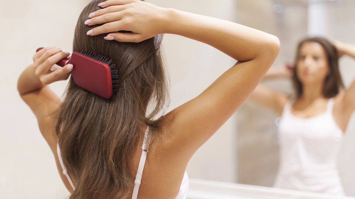 Woman brushing hair