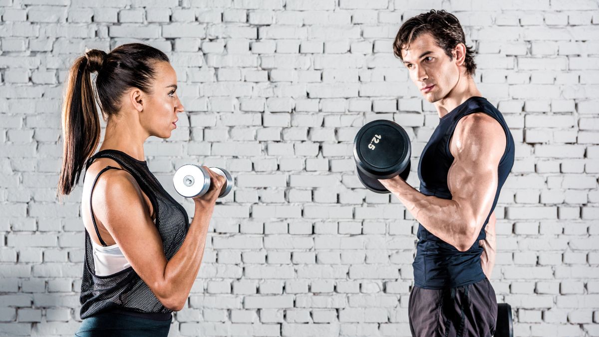couple lifting dumbbells