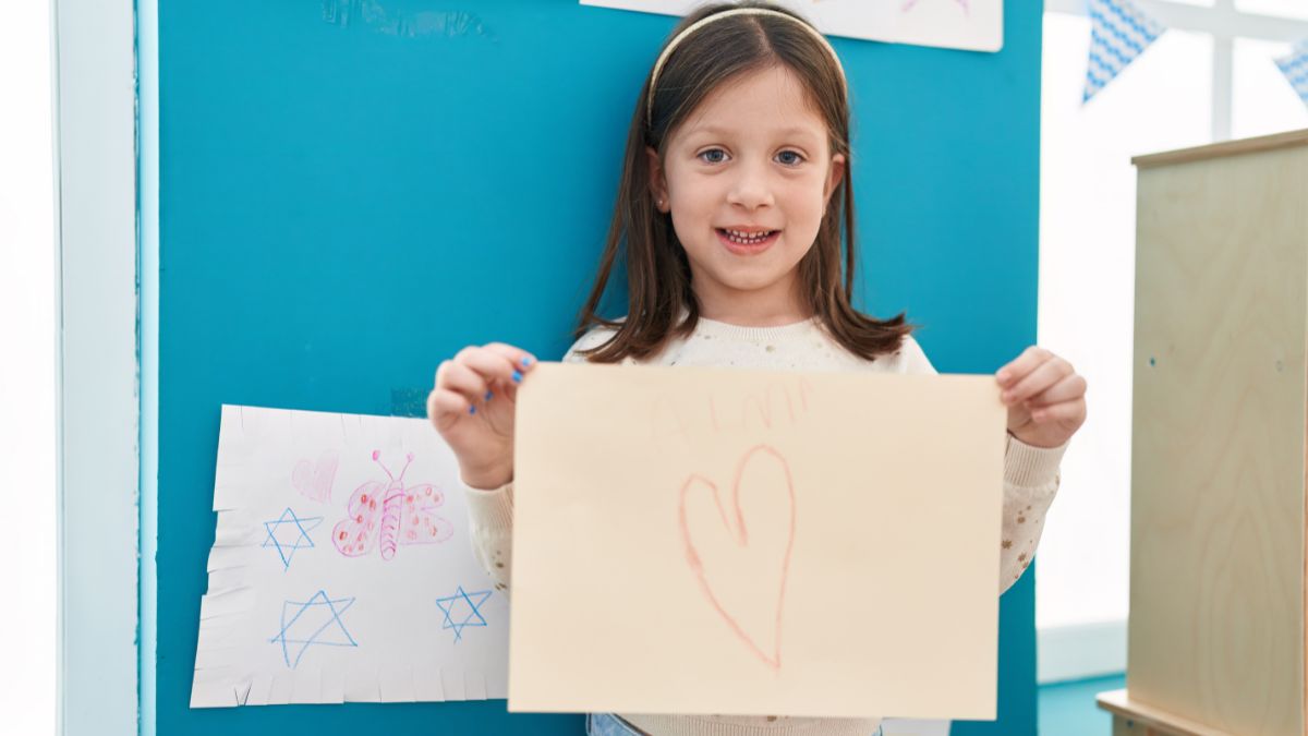 girl showing drawing