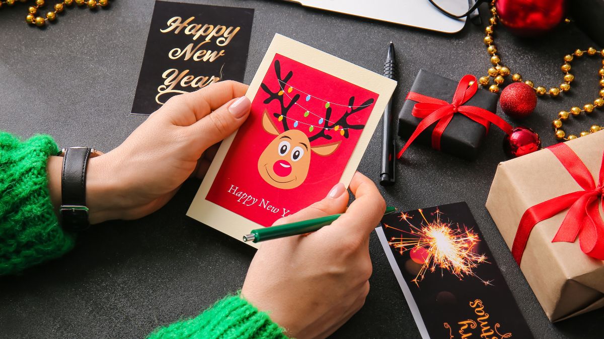 hands with holiday card