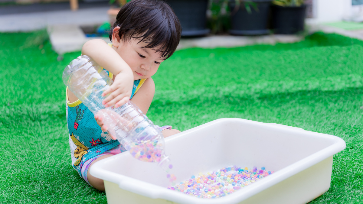 kid in sensory bin