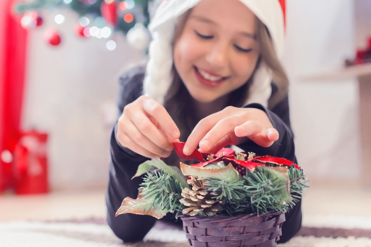 kid making Christmas crafts