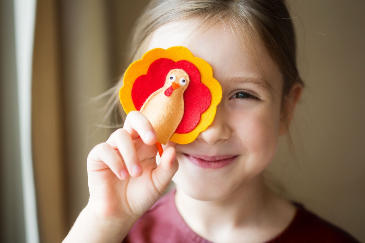 kid making DIY felt Turkey for thanksgiving day