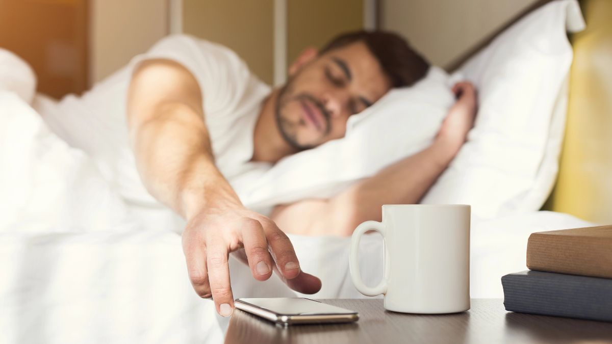 man getting weakeup call at hotel