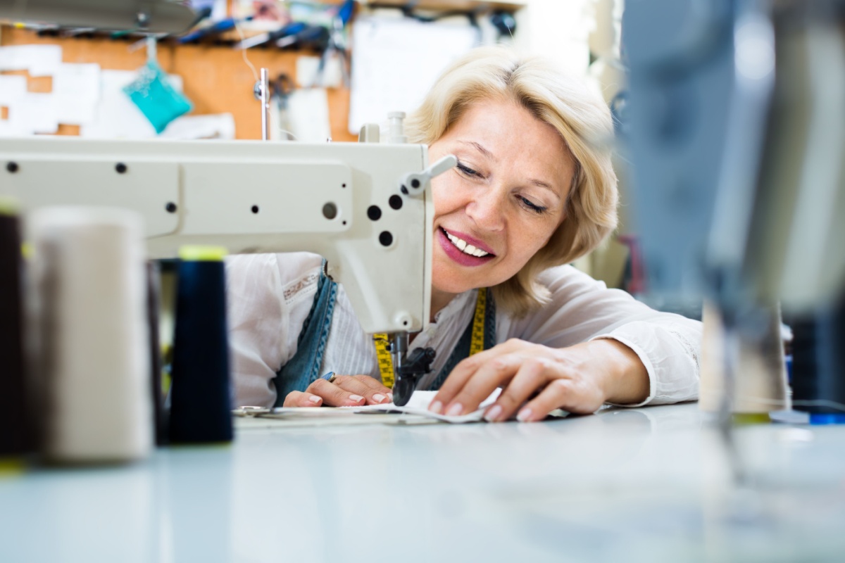 mature middle aged sewing machine