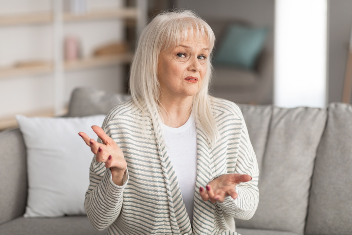 older mature woman shrugging confused