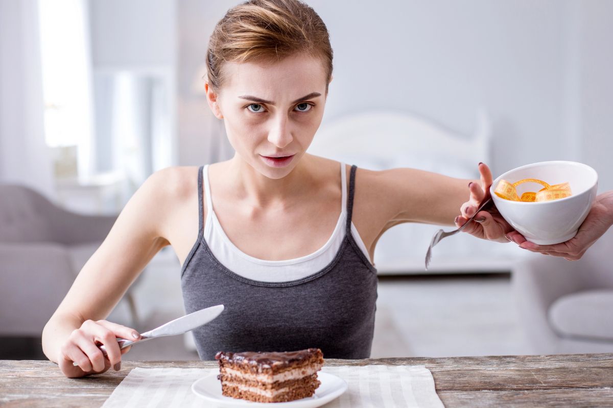 pale woman turning away oranges for cake