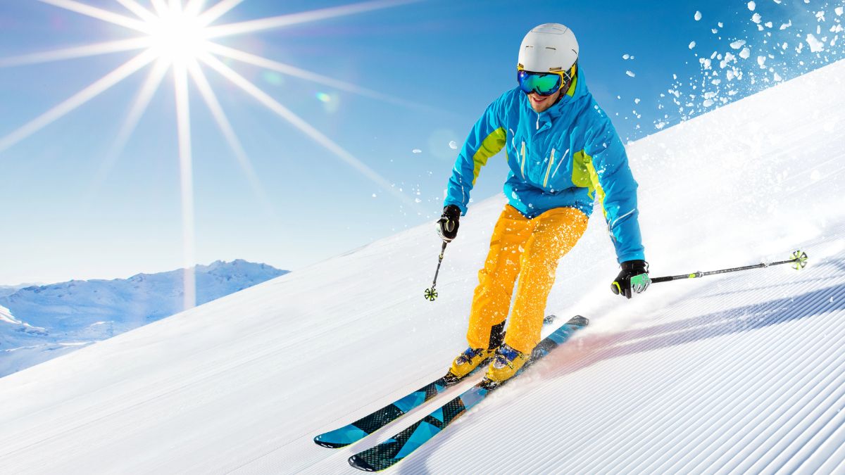 skier in blue and yellow