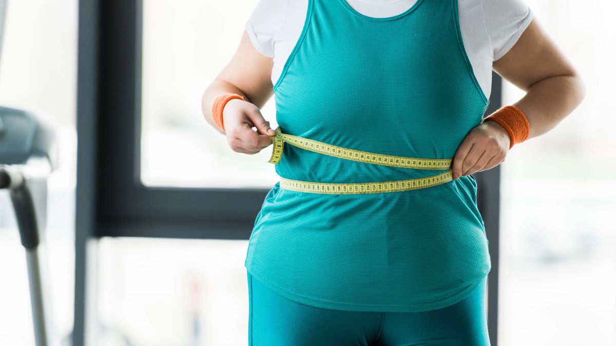 watching weight woman measuring body