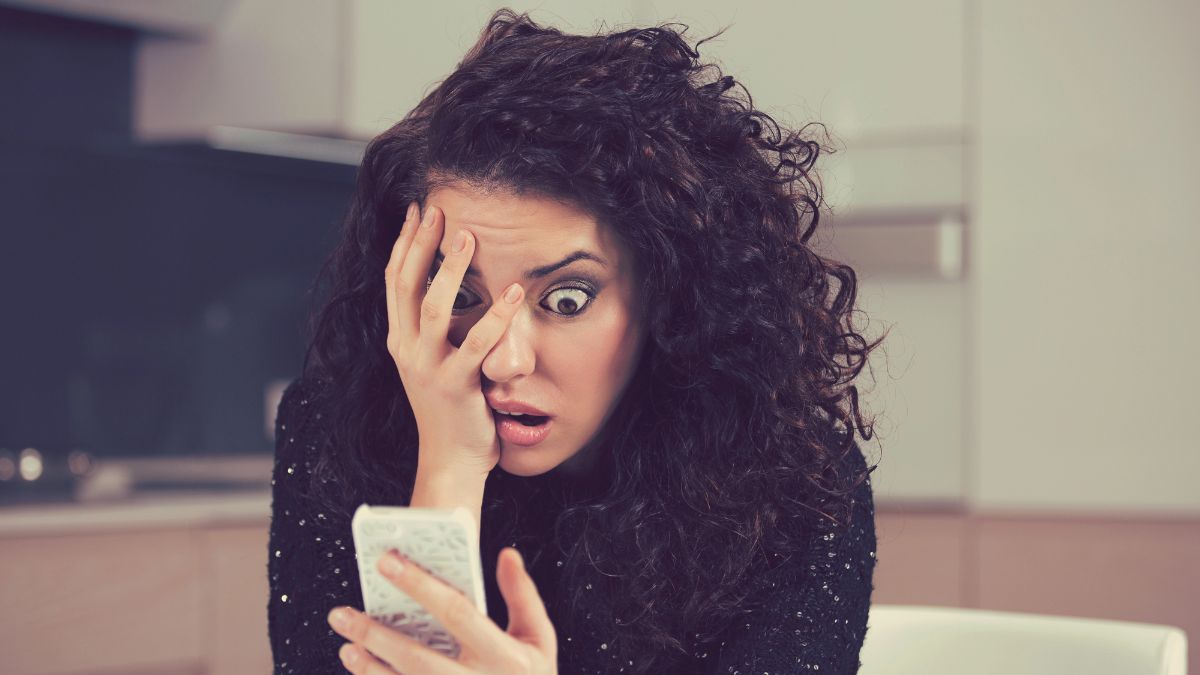 woman looking scared at phone