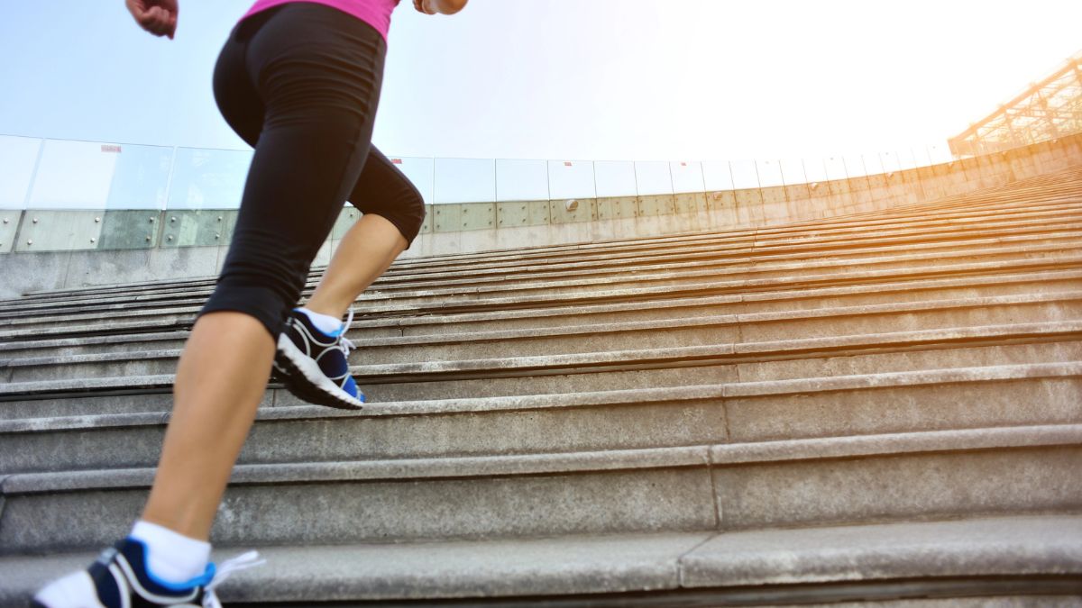 woman running up stairs