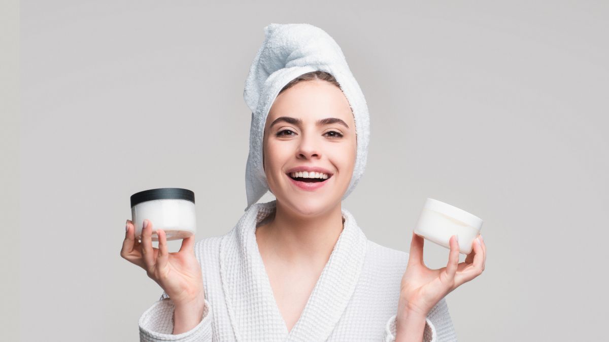woman with 2 tubs of cream