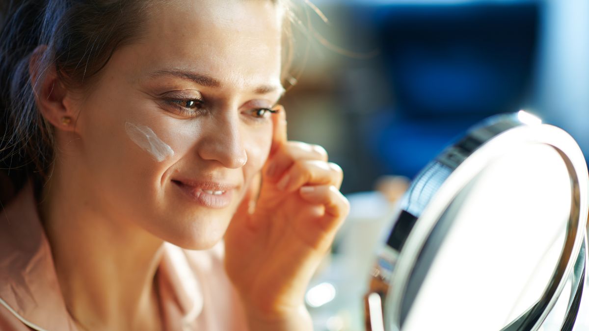 woman with cream on cheek