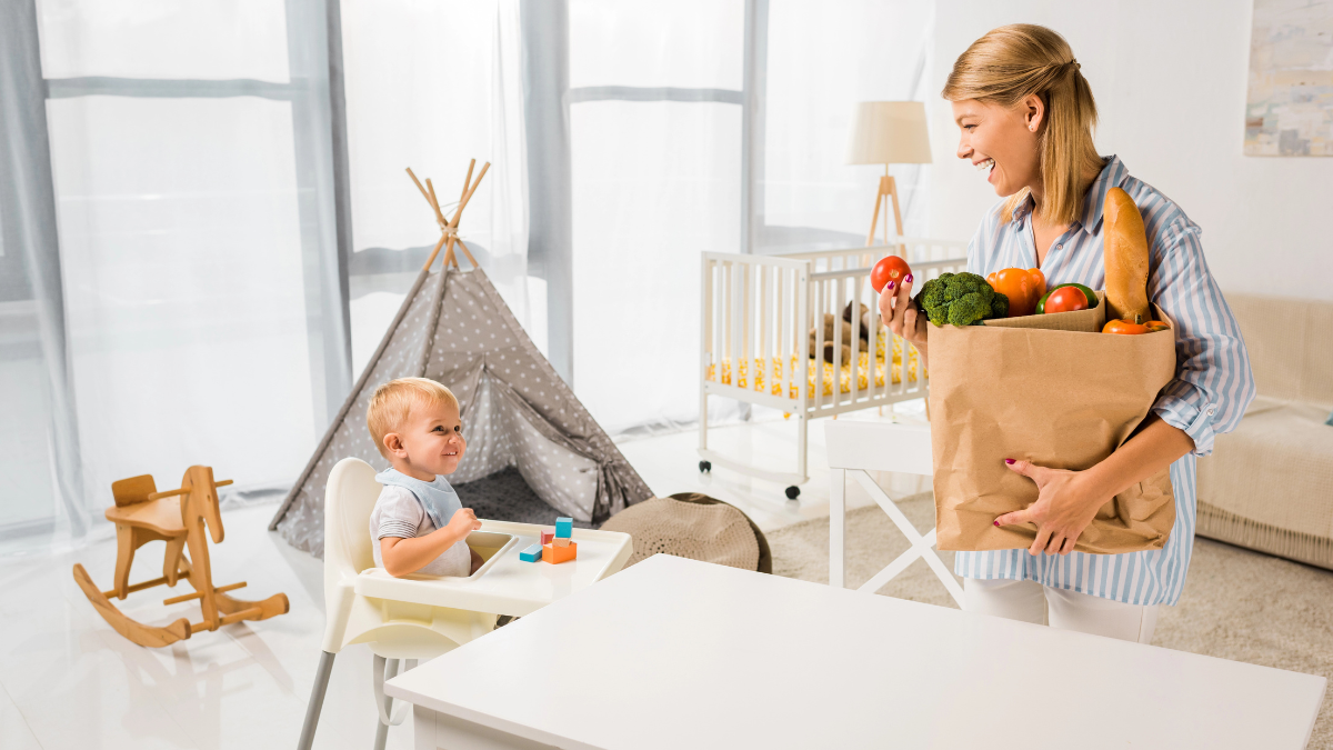 woman with groceries and baby